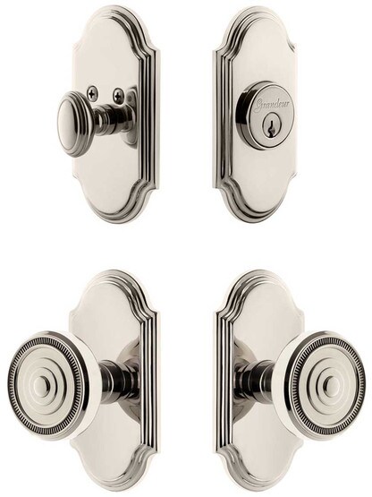 Grandeur Arc Entry Door Set, Keyed Alike with Soleil Knobs in Polished Nickel.